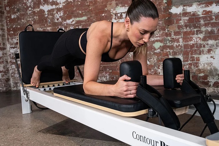 How Reformer Pilates Singapore Can Build Strength at Long Muscle Lengths Without Chasing Heavy Loads